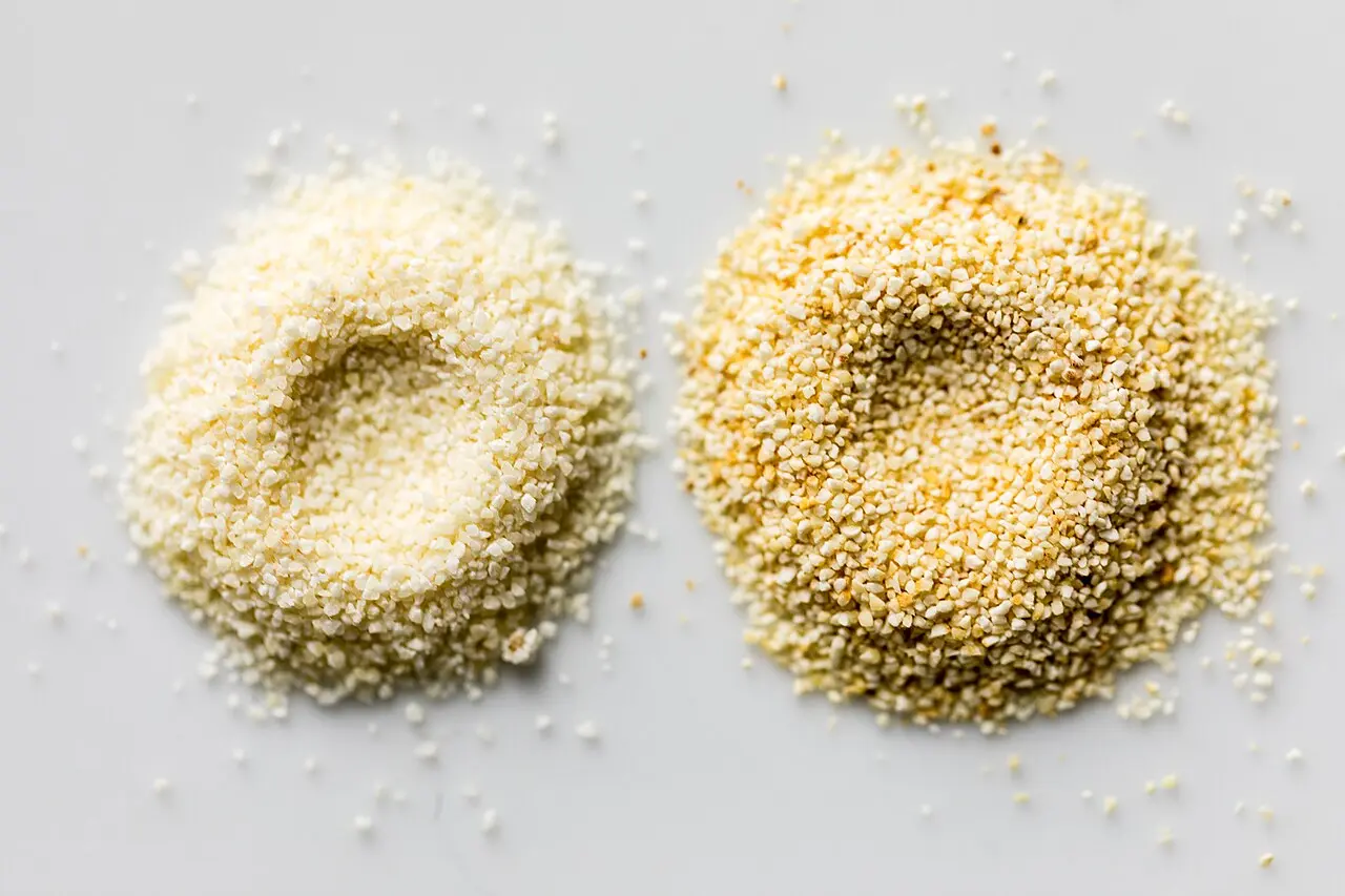 two small mounds of different semolina grinds on white